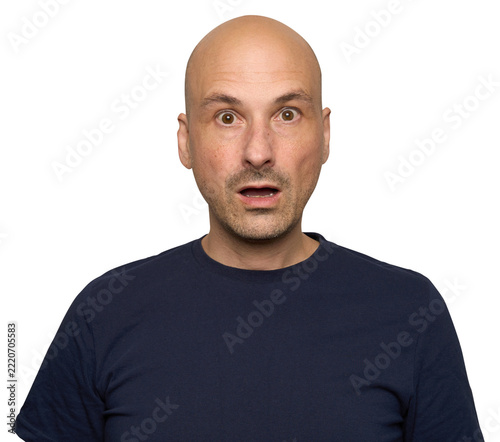 shocked bald man with wide‑open eyes and a slightly parted mouth