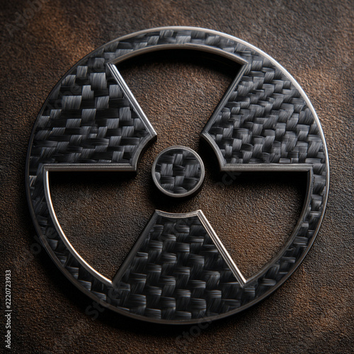 Radiation warning symbol made of carbon fiber on rusty brown background