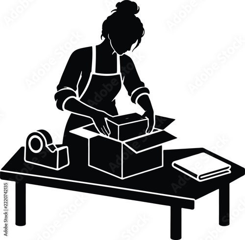 Small Business Owner Packs an Online Order at a Workbench