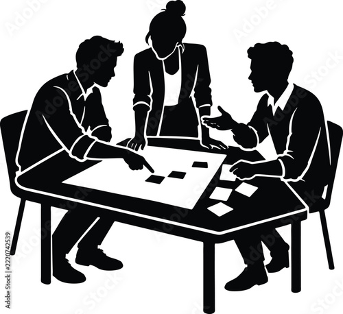 Three Professionals Collaborate Around a Table During a Project Planning Session