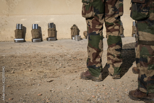 Mess tins lined up against a wall at the Foreign Legion training regiment in Castelnaudary, France