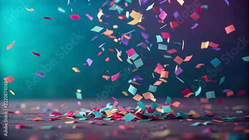 Colorful Confetti Falling on Dark Surface during Festive Celebration
