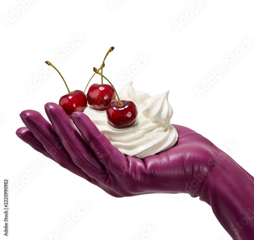 Fresh red cherries and whipped cream held on a purple gloved hand with sweet food white background delicacy delicious nutrition ingredient