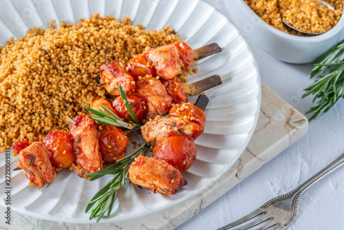 Spiced tomato and chicken skewers with mediterranean couscous
