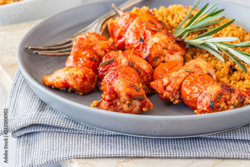 Spiced tomato and chicken skewers with mediterranean couscous