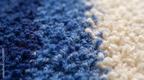 Shag rug displays soft blue and white yarn fibers in close-up perspective.