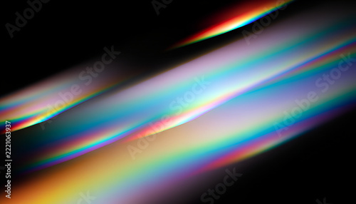 Rainbow prism light refraction overlay on black background
