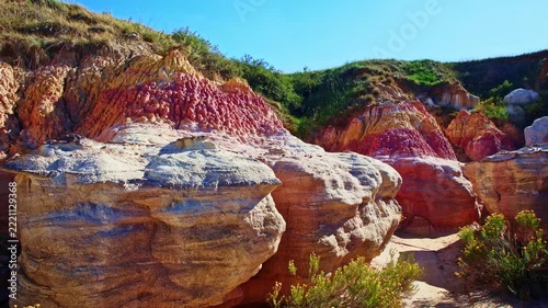 Vibrant pink and yellow geological formations rise at Paint Mines Interpretive Park in Calhan, Colorado