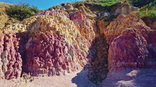 Vibrant pink and yellow geological formations rise at Paint Mines Interpretive Park in Calhan, Colorado