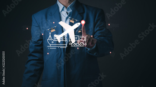 Businessman touches virtual airplane and logistics map, showing global cargo transport, supply chain export network, international freight delivery, and trade solution.