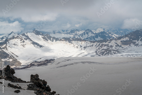 Cloudy sky over snowy mountains and glaciers