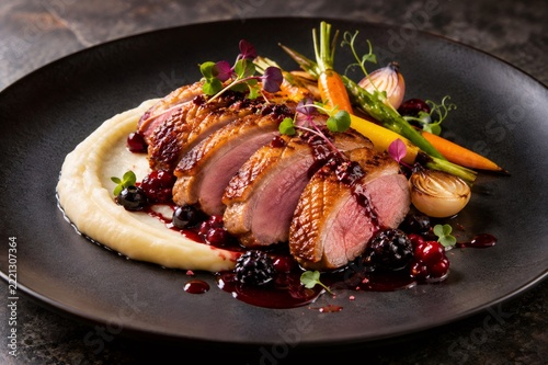 Roasted duck breast with berry sauce and mashed potatoes