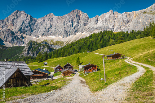 Fantastic alpine landscape with old wooden chalets in Austria
