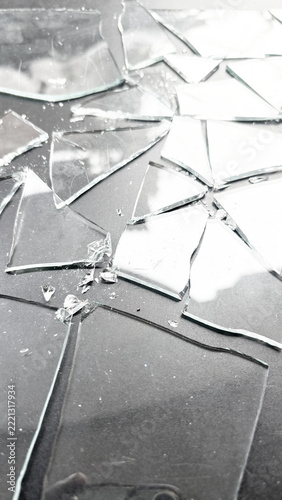 Fotografie Shattered glass fragments on a checkerboard preview background, cracked transpar