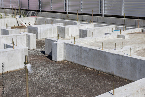 Concrete foundation with anchor bolts at a residential construction site