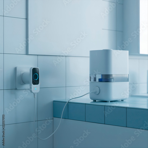 Smart plug adapter powering ultrasonic humidifier on tiled counter.
