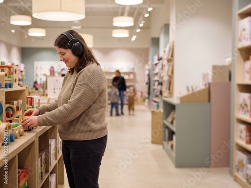 Woman Browsing Shelves in Sensory Friendly Accessible Holiday Shopping Toy Store