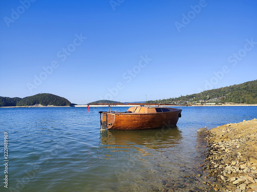 Wooden boat at lake in Bieszczady National Park, Poland