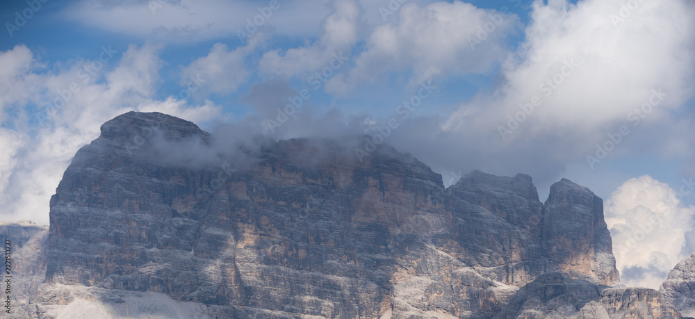Fototapeta premium Mountain landscape panorama Tre Cime Mount against a blue summer background. 