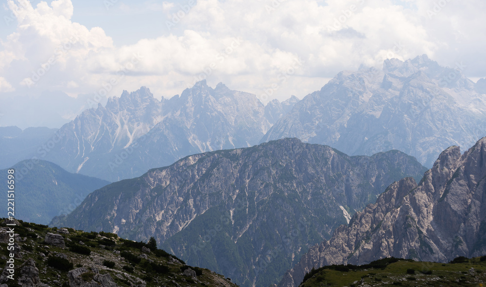 Fototapeta premium Mountain landscape panorama Tre Cime Mount against a blue summer background.