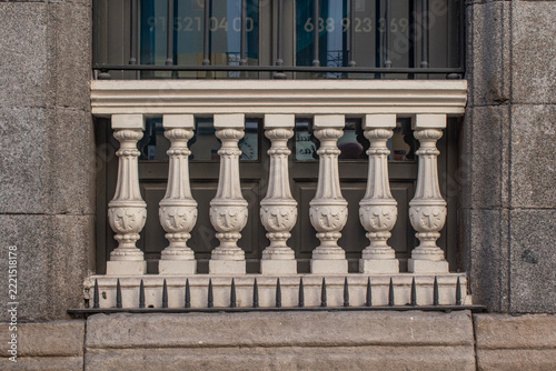 Decorated stone balustrade on a building in Madrid, Spain.