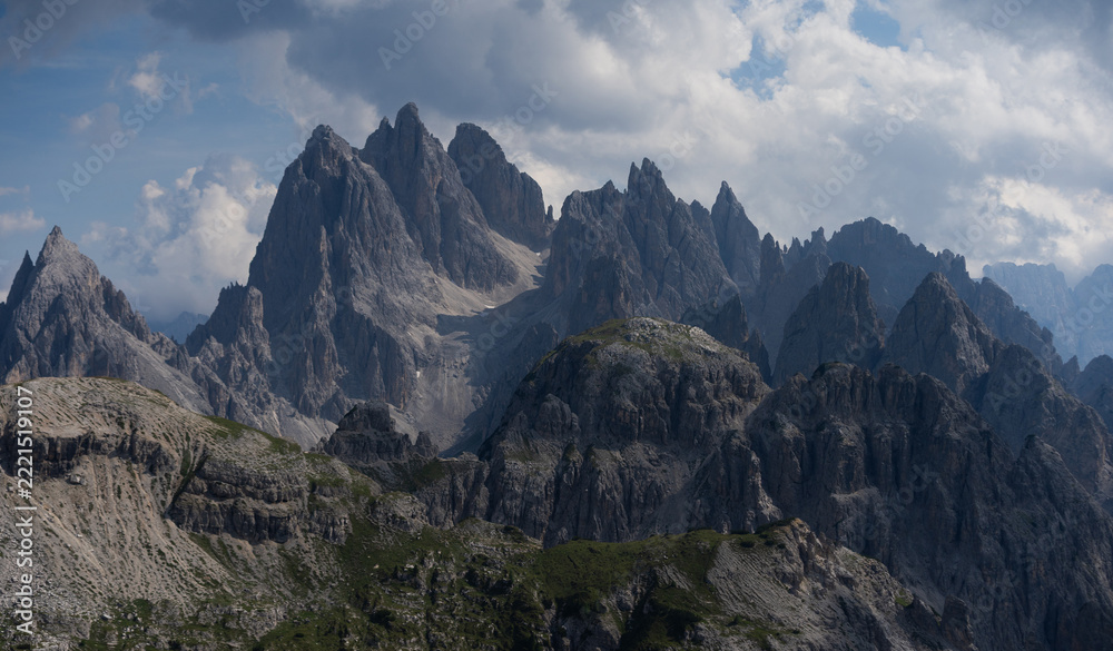 Fototapeta premium Mountain landscape panorama Tre Cime Mount against a blue summer background. 