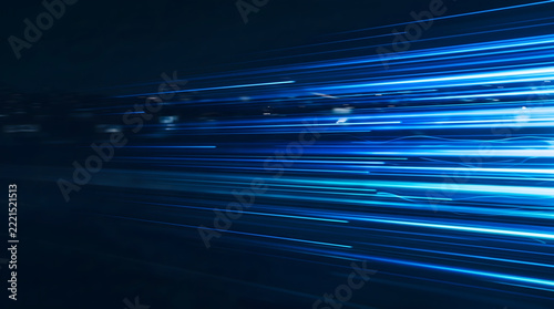 Abstract horizontal streaming blue light rays with high velocity motion blur on black background suitable for 5g internet speed network connection and futuristic technology presentation