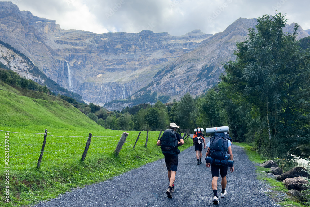 Fototapeta premium Hiking trail to Gavarnie Falls, spectacular waterfall in french Pyrenees, highest waterfalls in France, popular tourist landmark