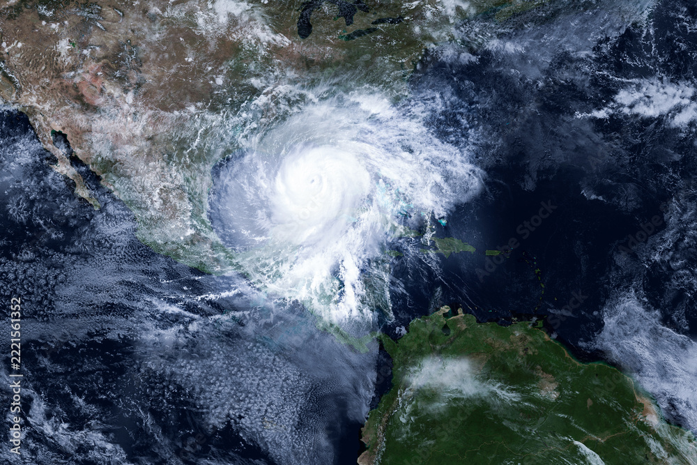 Naklejka premium Satellite view of a massive hurricane spinning over the Gulf of Mexico, featuring a clear eye, swirling white storm clouds, and dramatic atmospheric perspective over Central and North America. Isaias