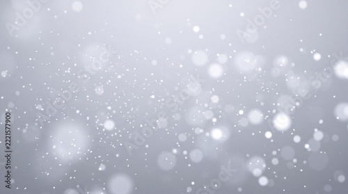 Minimalist white abstract background featuring soft bokeh lights and delicate falling particles. Elegant light gray texture with glowing dots and dusty glitter effect for festive or professional.