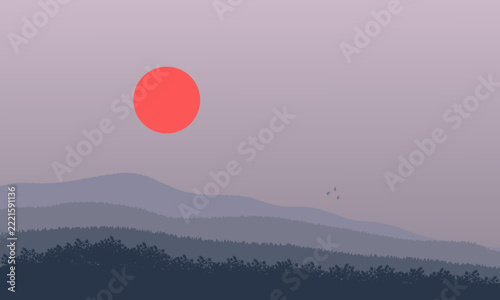 A minimalist view of grey mountains at sunrise with forests shrouded in smoke from fires.
