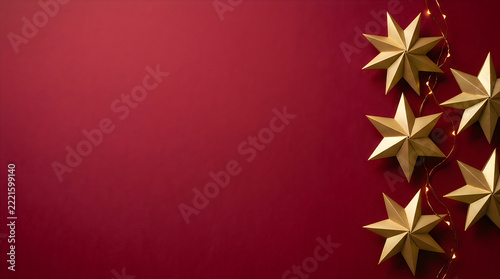 Golden Christmas Stars on Deep Red Background, Elegant Holiday Banner with Copy Space, Festive New Year Backdrop