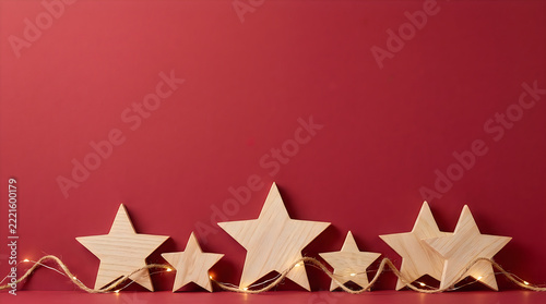 Festive wooden stars background for Christmas design, rustic holiday decorations, copy space for seasonal banner