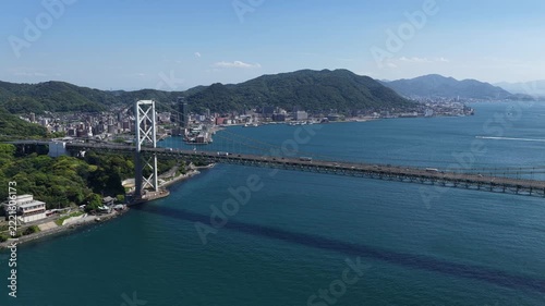 Aerial drone footage of Kanmon Bridge over Kanmon Strait in Yamaguchi Japan