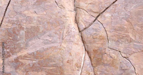 Natural Cracked Rock Texture with Intersecting Fractures and Pink Beige Stone Patterns