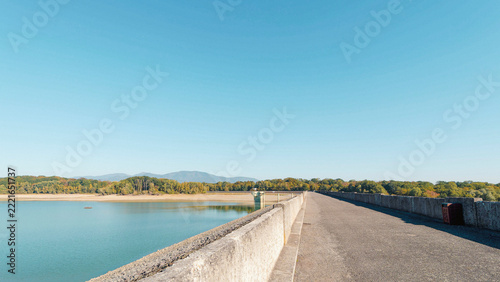  Lake Michelbach in Aspach-Michelbach community of the Haut-Rhin department. The main dike with a view of the lake's water intake tower. The dry northern shore bordering the Gruenewald forest