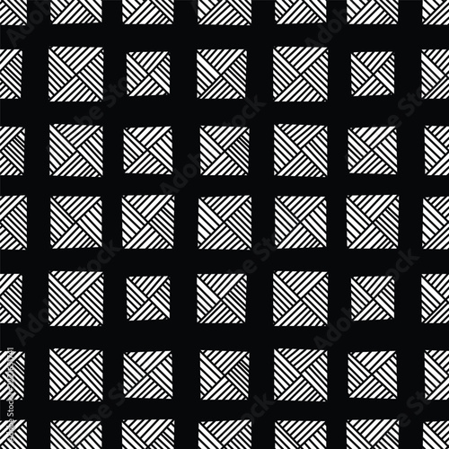 A seamless black and white geometric pattern featuring regularly spaced squares filled with intersecting diagonal lines against a dark background.