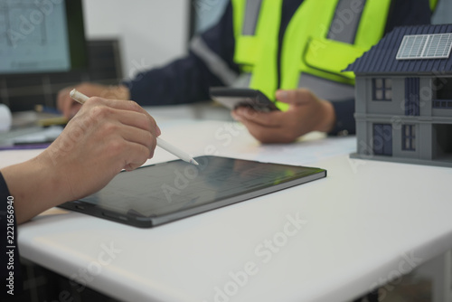 Tablet, stylus, hand, model, house, solar panel support digital planning during construction consultation