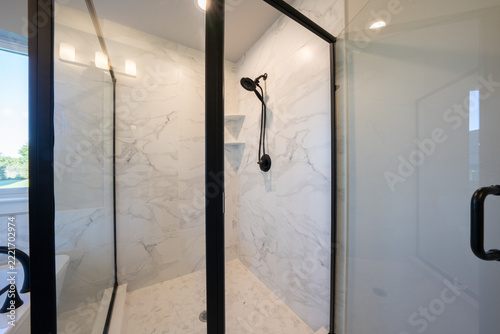 Bathroom shower has been updated with new ceramic tile and fixtures