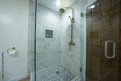 Bathroom shower has been updated with new ceramic tile and fixtures