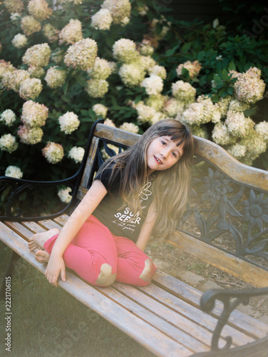 medium format film portrait of girl in garden in september