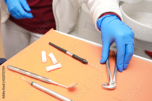 Dental tools and materials on a table in a clinic during a preparation for a procedure