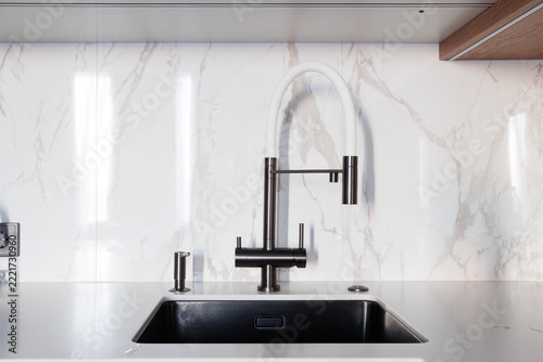 kitchen faucet on a stylish metal sink