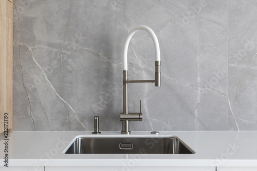 kitchen faucet on a stylish metal sink