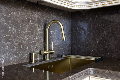 kitchen faucet on a stylish metal sink