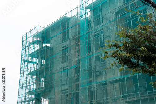 Green safety mesh on a building in Da Lat Vietnam