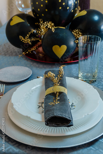 Elegant black and gold celebration table setting