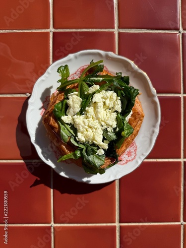 Savory Puff Pastry Tart Topped with Fresh Greens and Feta Cheese