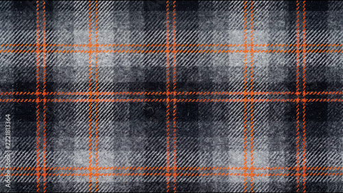 Dark grey and orange checkered plaid wool fabric textile texture pattern background for winter clothing