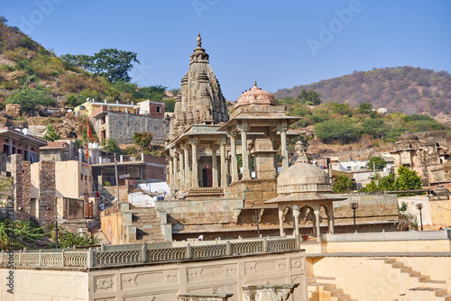 Obraz na plátně Ancient Hindu temple complex constructed from carved sandstone, featuring a prominent shikhara tower, domed pavilions, and columned mandapas situated on a raised platform with stone staircases